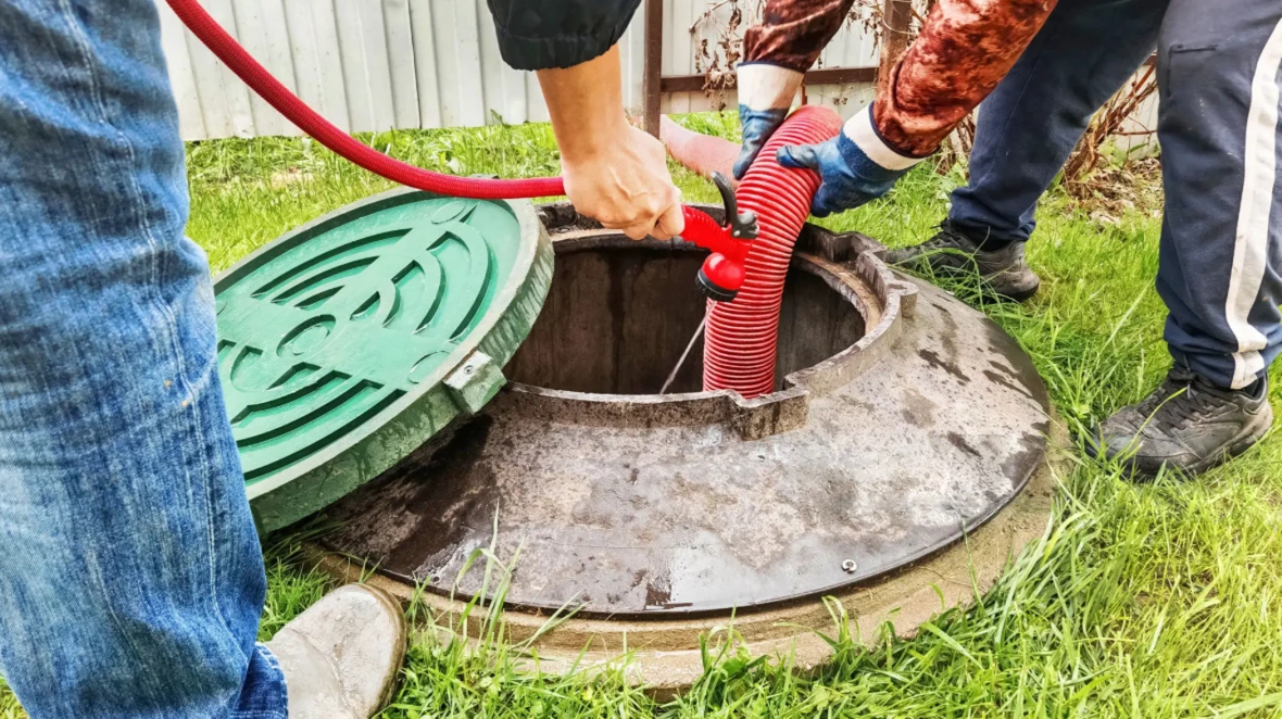 Septic tank pumping truck in action in Montgomery County